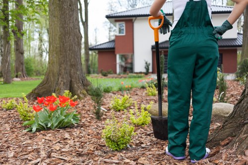 Gardeners in Blackfriars improving a private city garden